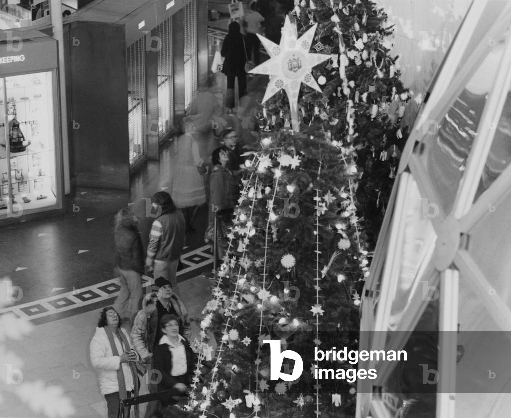 A Tree Topped With A Large Star On Display During The Christmas Around The World Exhibit