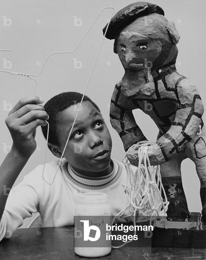 A Young Boy Making a Papier Mache Figure, Chicago Public Schools Art Fair, Museum of Science and Industry, Chicago, Illinois, 1968 (b/w photo)