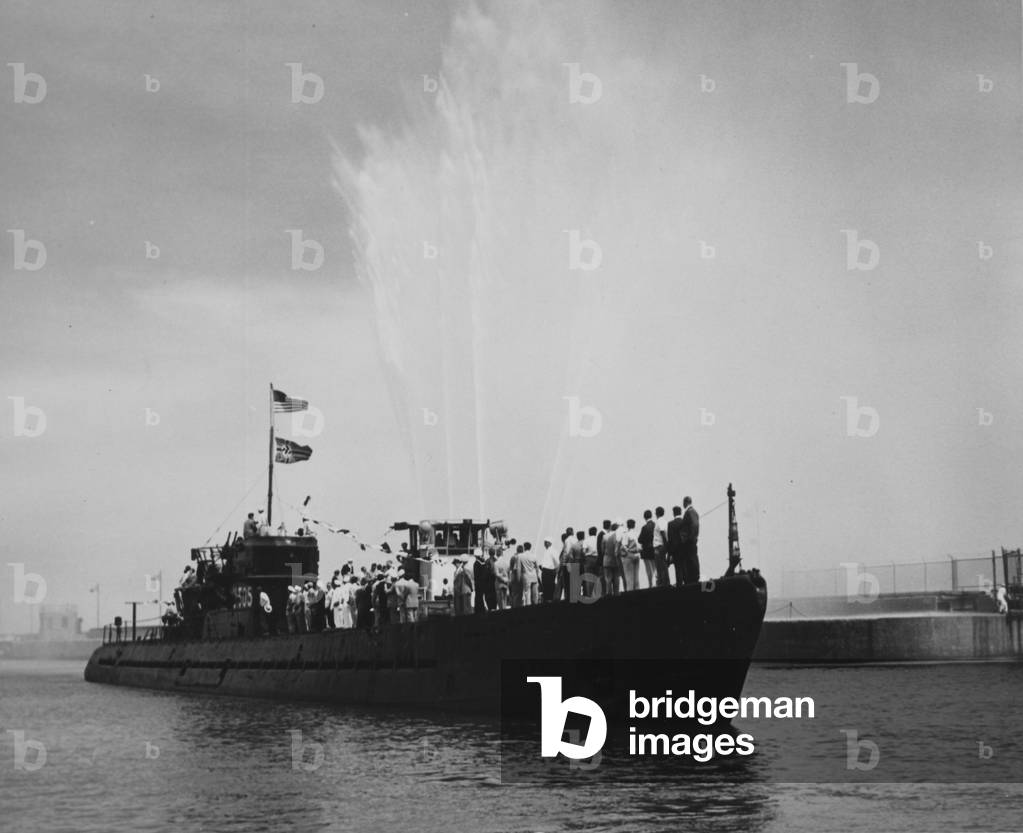 Delegates Line The Decks Of The Captured German Submarine U505 As It Arrives In Chicago With A Fireboat Spraying Water Into The Air Around It