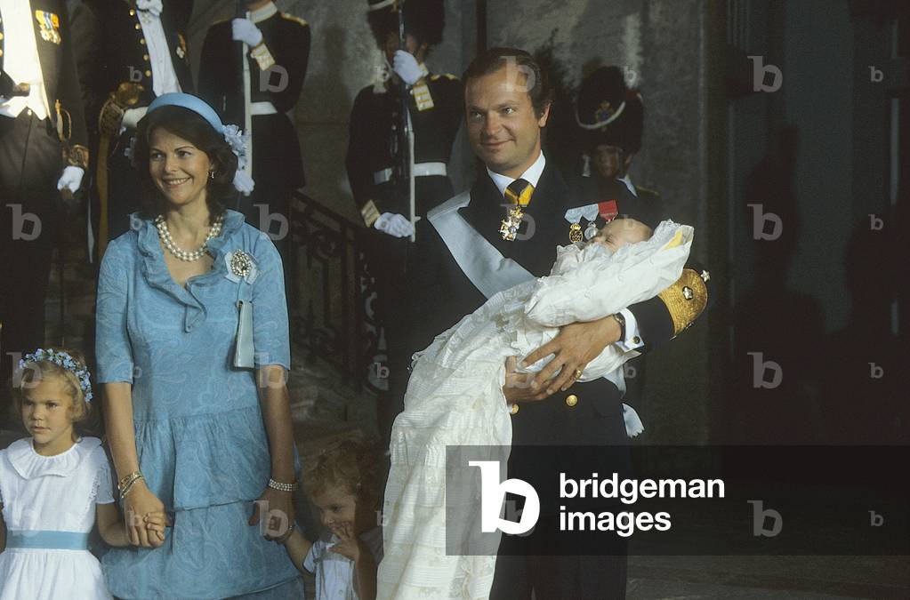 The King Carl XVI Gustaf holding princess Madeleine during the baptism of her in Slottskyrkan Stockholm 31 August, 1982 (photo)
