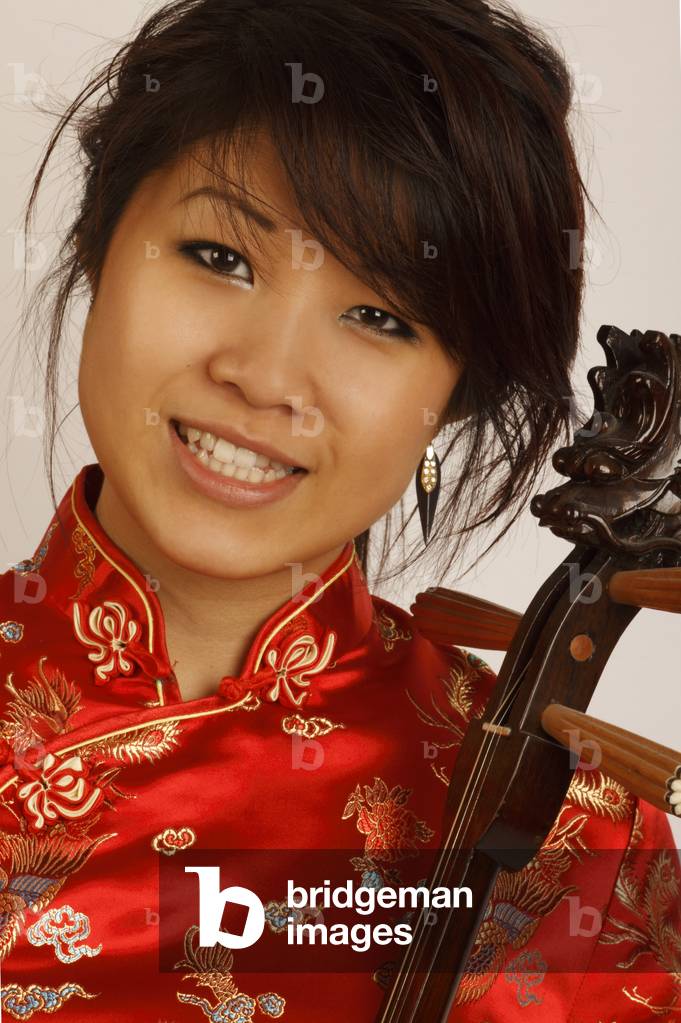 Chinese girl playing a Sanxian or San Hsien 3 stringed lute