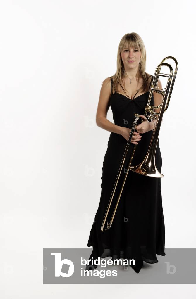 Female trombone player holding her trombone