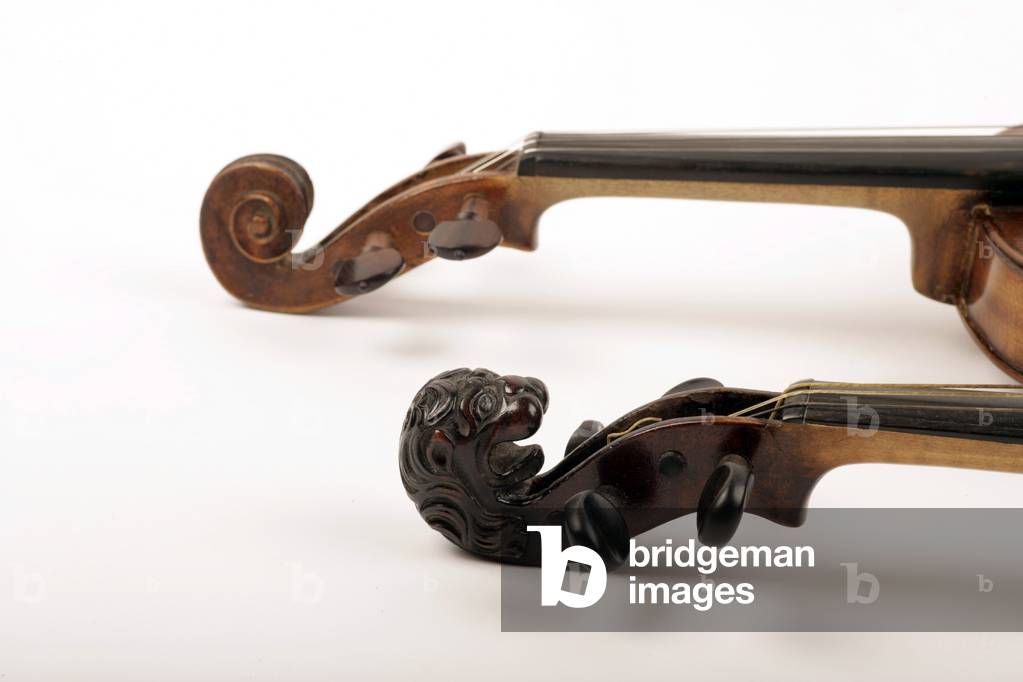 Two violin scrolls -