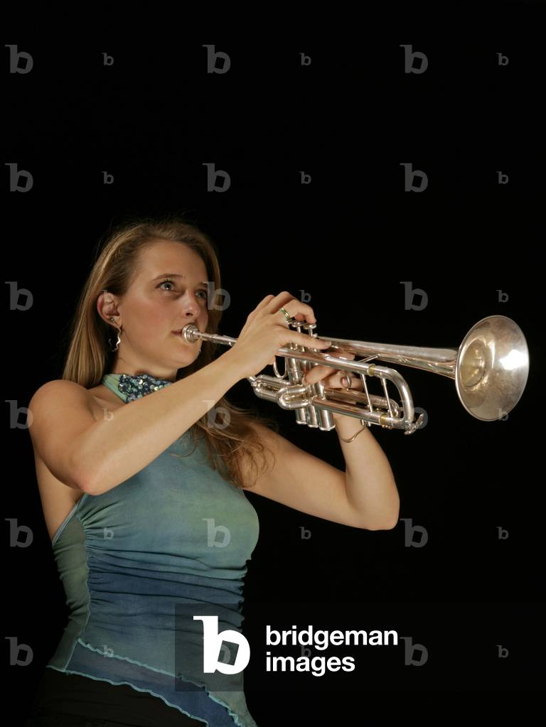 Young female trumpeter in