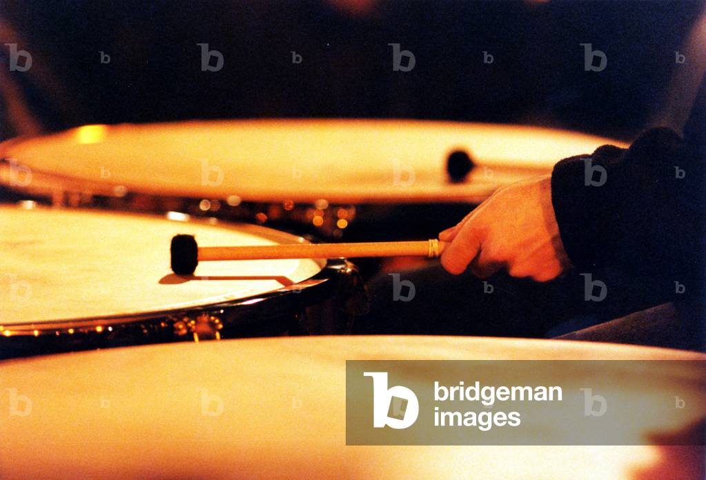 Timpani being played with