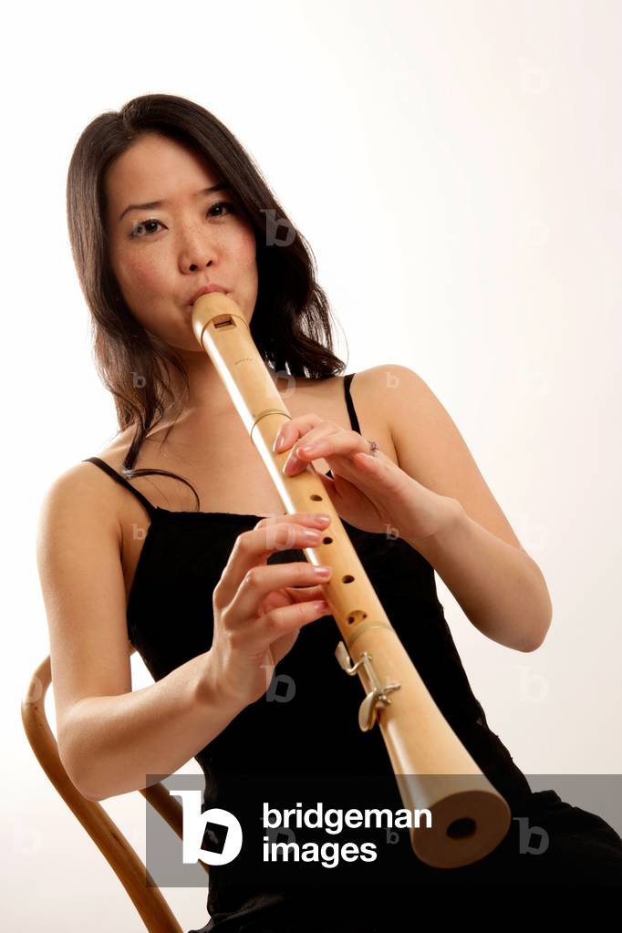 Young woman playing the tenor