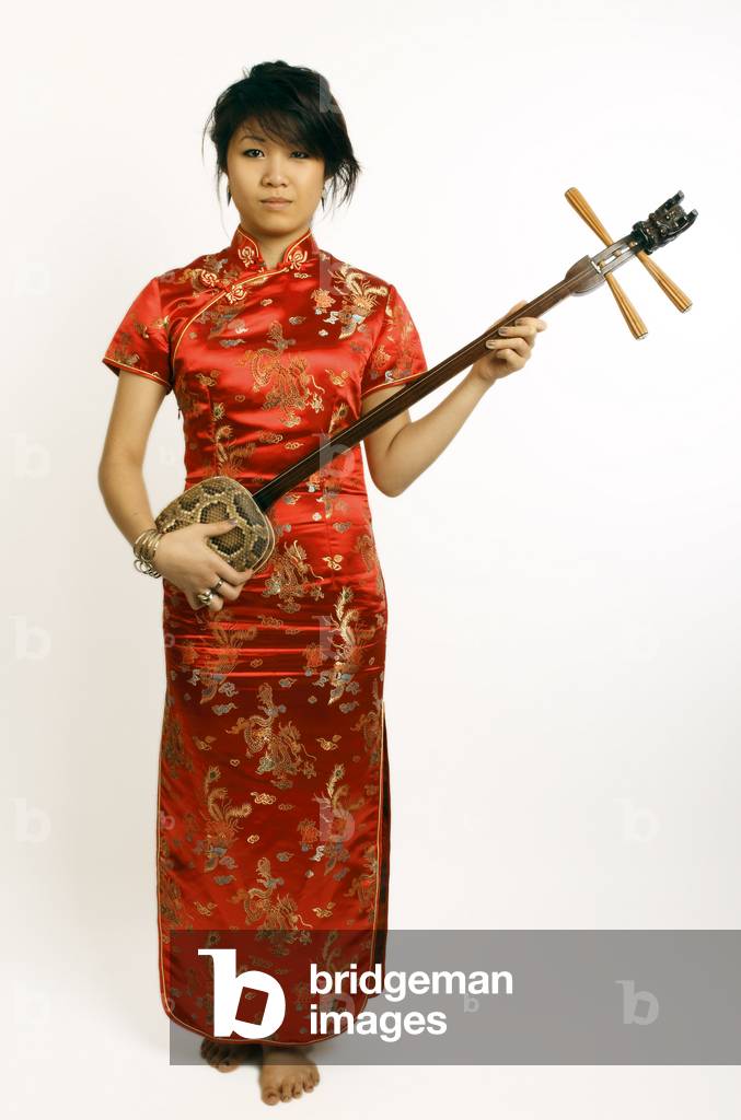 Chinese girl playing a Sanxian or San Hsien 3 stringed lute