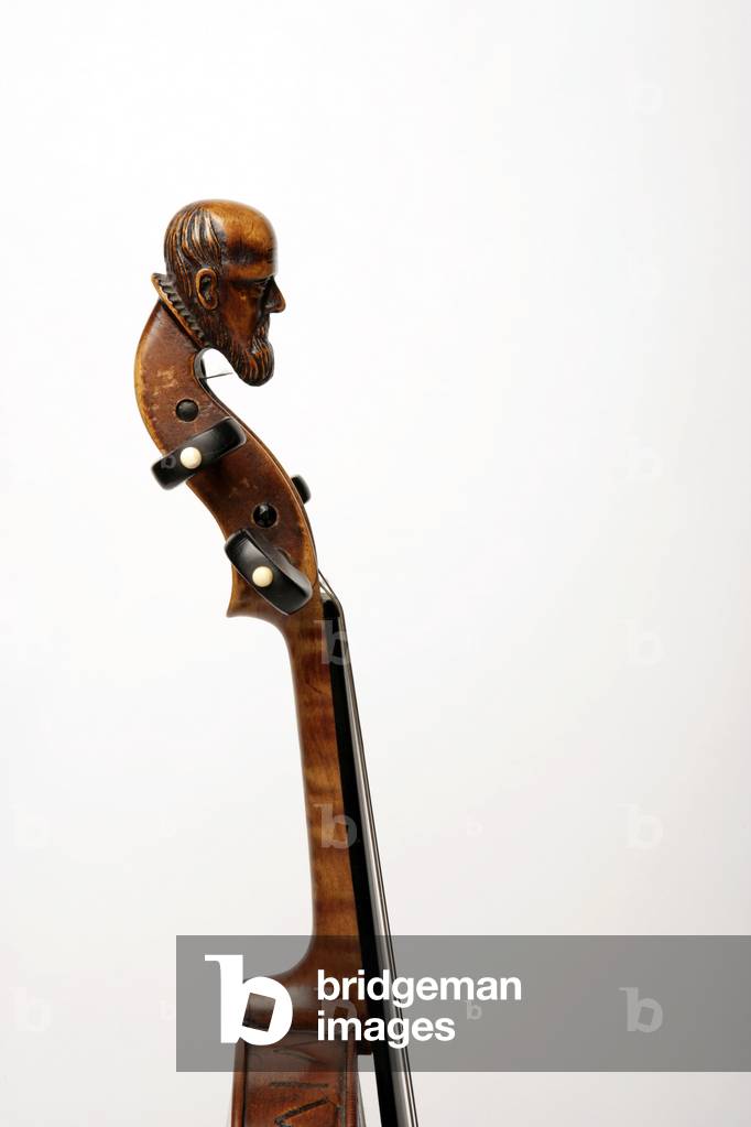 Carved head at the top of a violin scroll