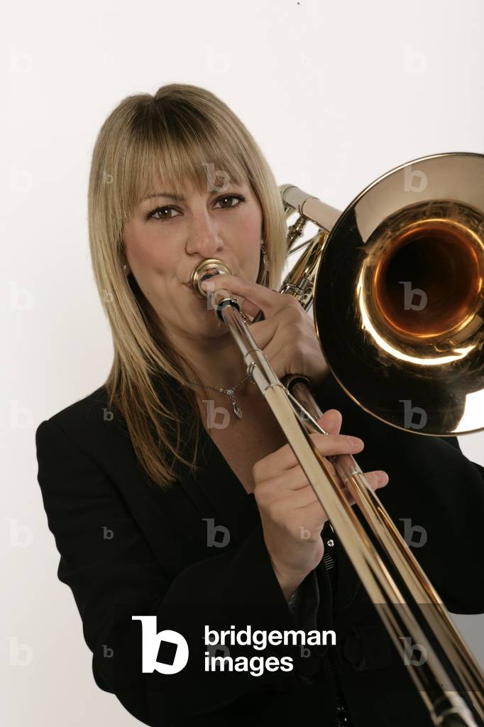 Female trombone player in playing position