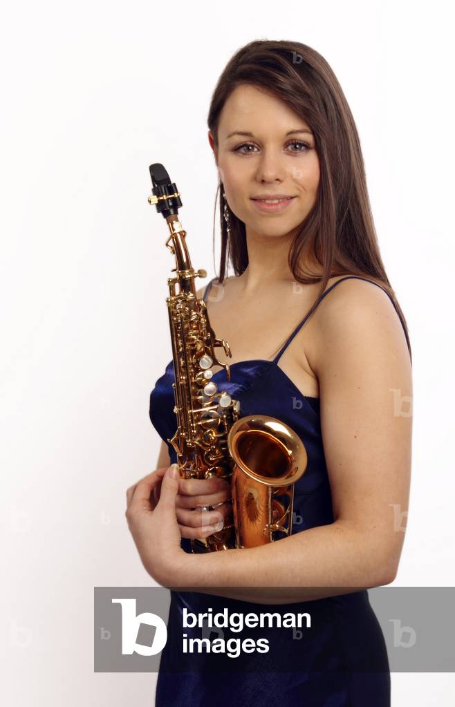 Young woman holding a soprano saxophone