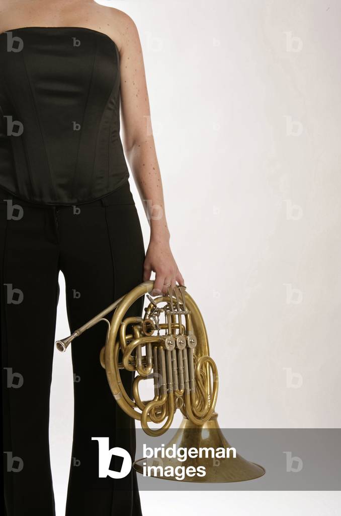 French Horn player holding