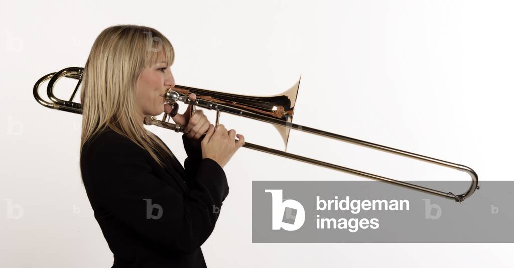Female trombone player in playing position