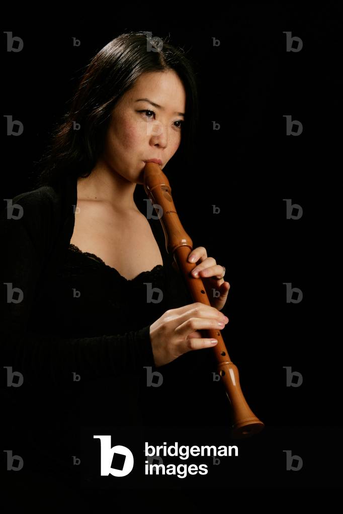 Young woman playing the alto