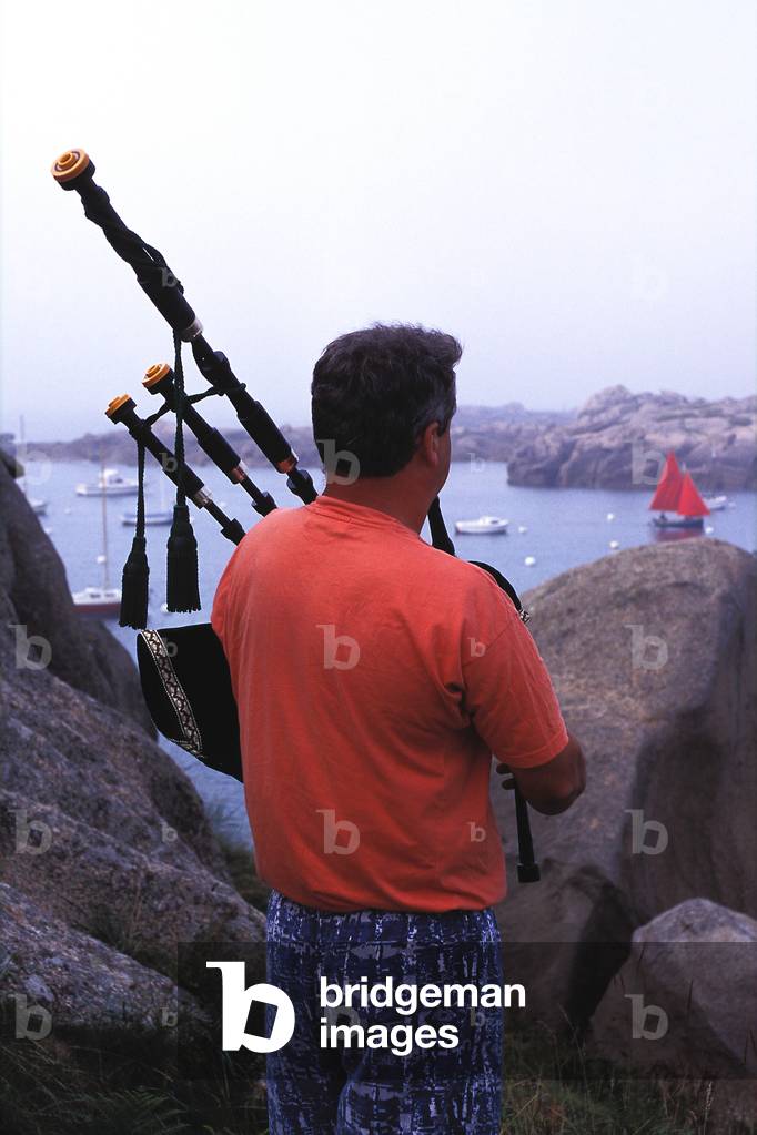 Breton Bagpiper looking out