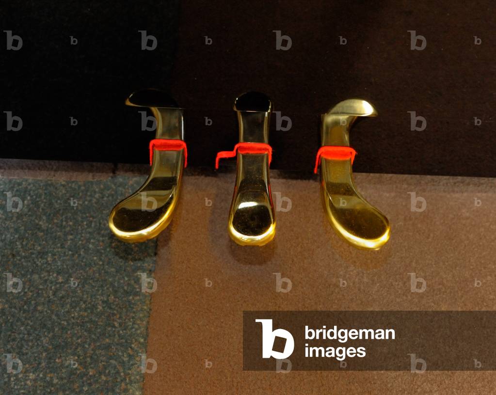 Three pedals of Kawai upright piano