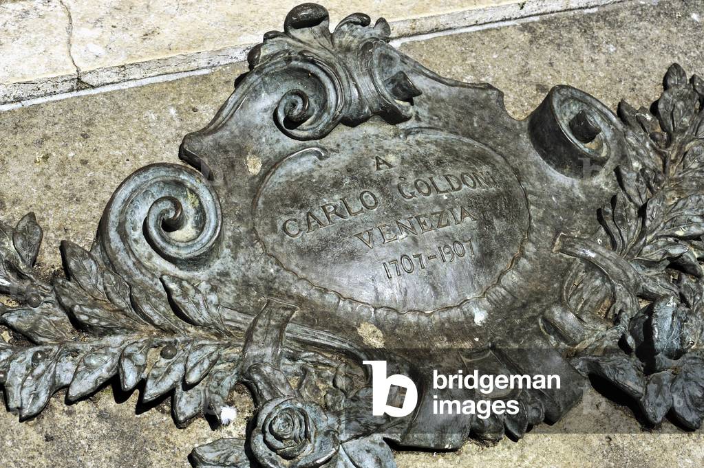 Goldoni statue plaque for bicentenary 1907 (1707-93), in Campo San Bartolomeo near the Rialto; Carlo Goldoni was one of the finest comedic playwrights in Italy and wrote over 250 works both in Italian and French, sculpted by Antonio Dal Zotto (1841-1918)