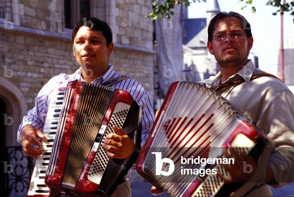 Two buskers playing Hohner