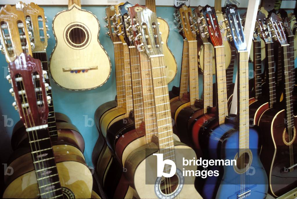 Guitars for folk music in shop of guitar maker