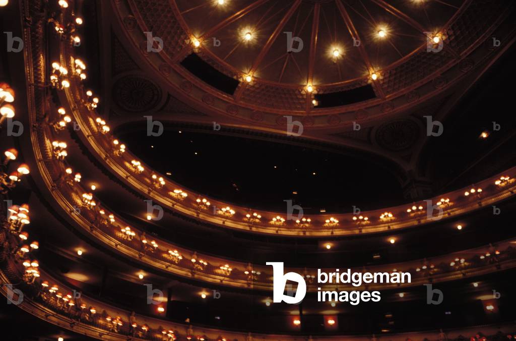 Auditorium, circle seats, ceiling lit up for performance at London Royal Opera House, Covent Garden