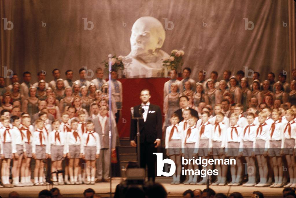 Children 's choir of Young Pioneers, Soviet youth organization, with bust of Lenin in background, Tallinn, Estonia, 1966
