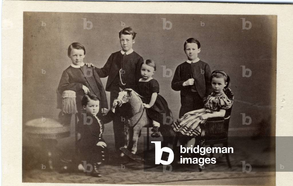 Group of six children around their rocking horse, 1860s (albumen print)