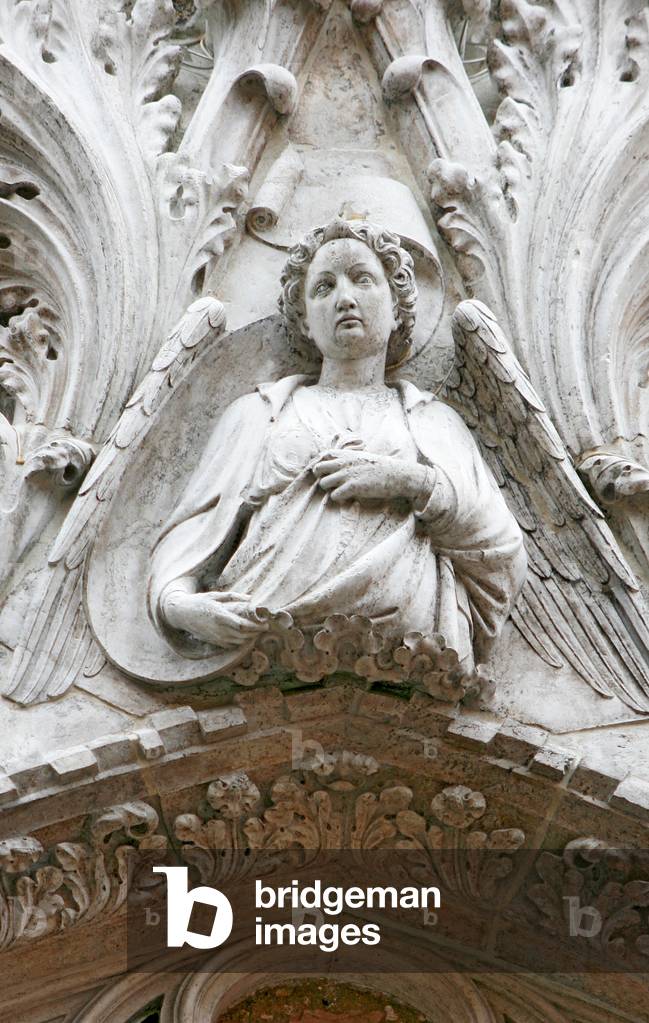 Sculpture of an angel above the portal of the Church of Santo Stefano, Venice