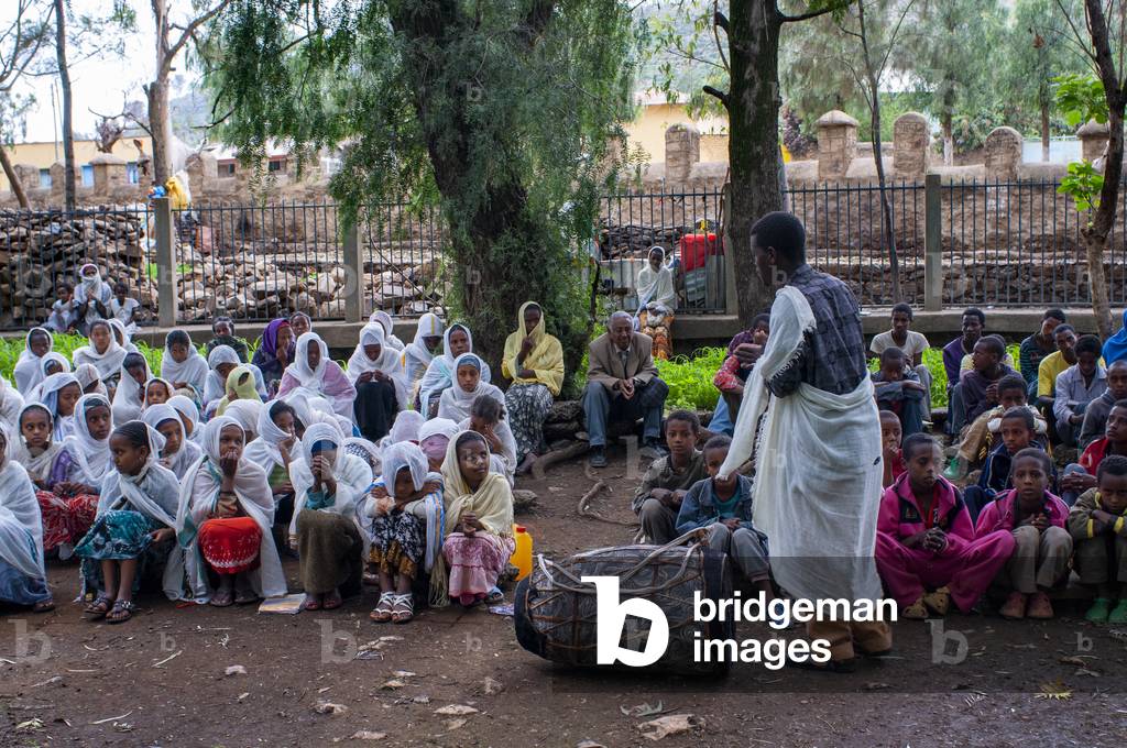 St Mary of Zion church, Aksum, Ethiopia, Several separated boys and girls are doing catechesis inside the church of St Mary of Zion in Axum (photo)