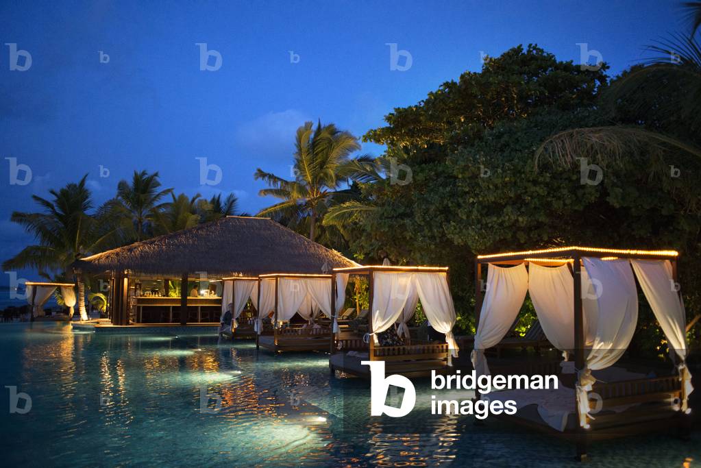 Swimming pool and restaurant in The Residence Hotel and Resort, Gaafu Alifu Atoll, Maldives Islands (photo)