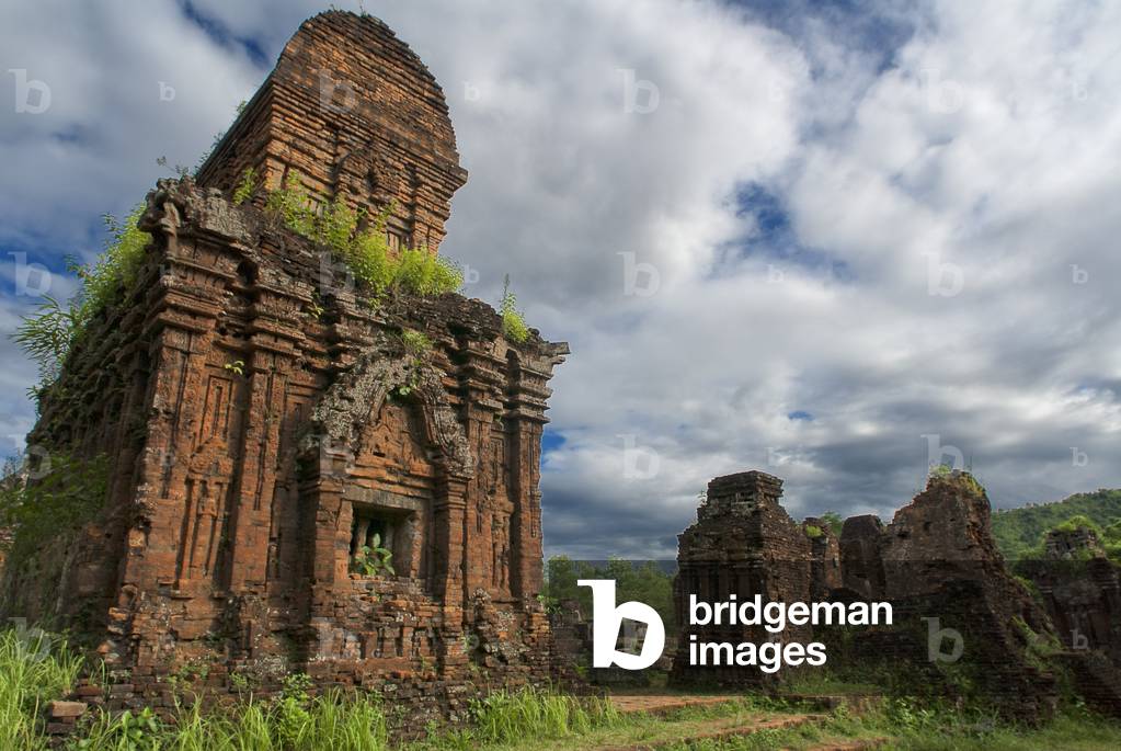 My son, Ancient tower at a world heritage archeaological site of the Champa Kingdom, My Son archaeological site, Vietnam (photo)