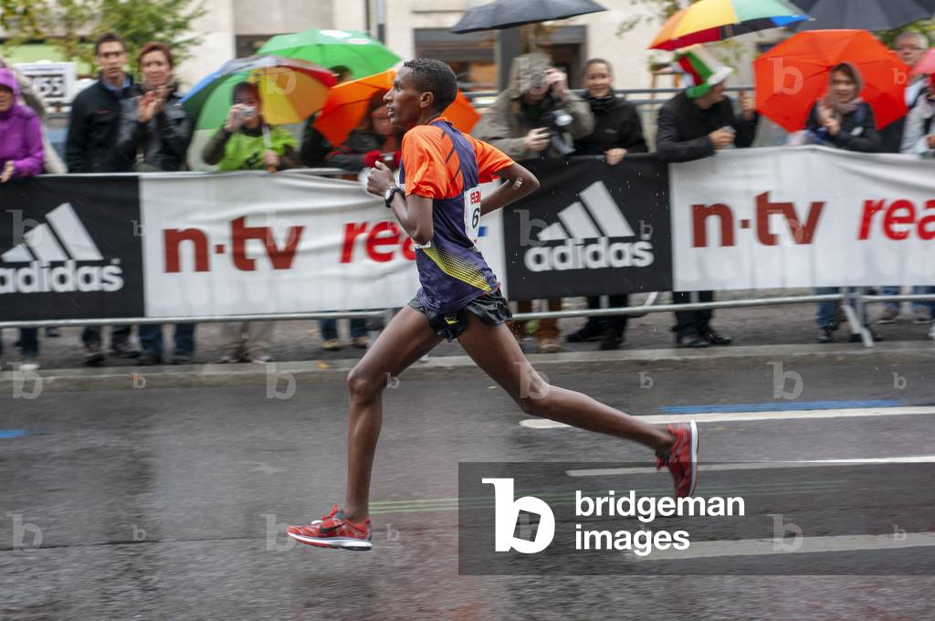 Black African participant of the Berlin Marathon at kilometer 40, Berlin, Germany, Europe (photo)