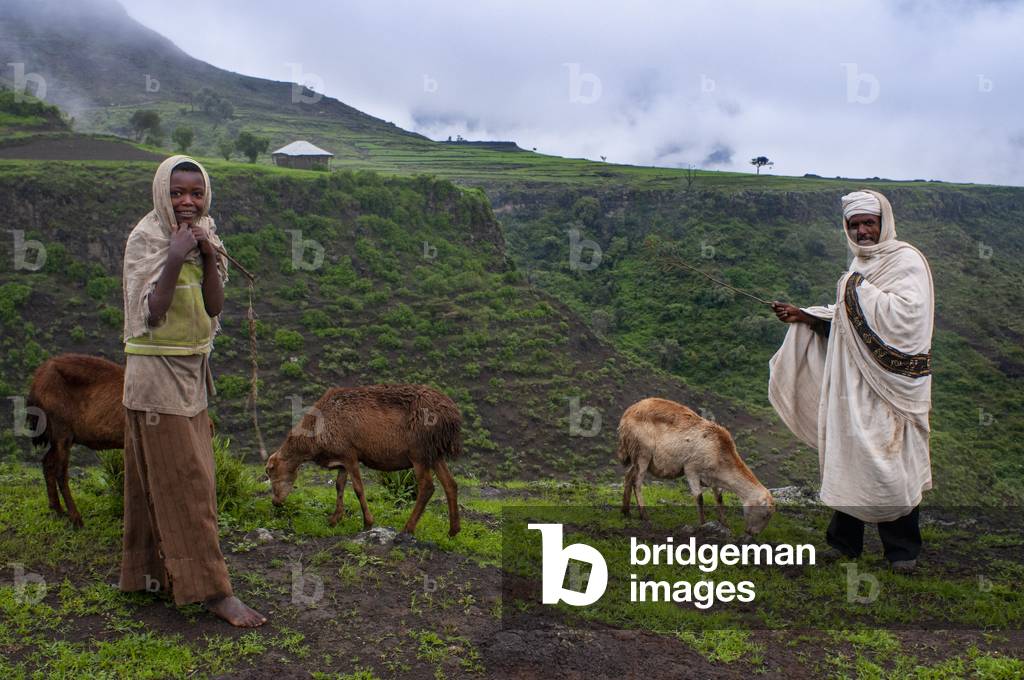 Children and traditional african village house in Lalibela village in Amhara region, Northern Ethiopia (photo)