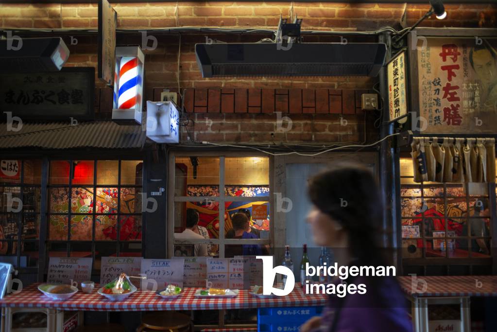 Dining under the train tracks: the Yakitori alley, Tokyo, Japan, March 2020 (photo)