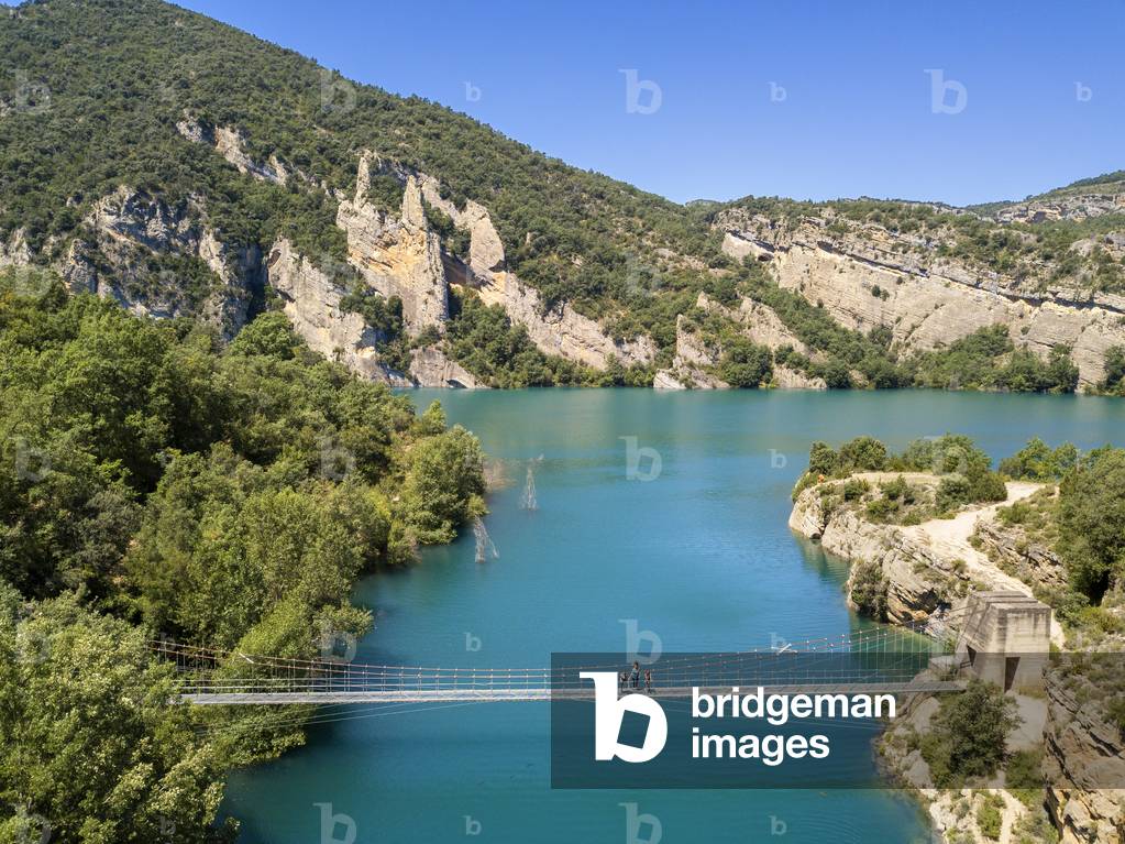 Congost de Mont-Rebei in the Pre-Pyrenees of Lleida, Catalonia, Serra del Montsec, La Noguera, Lleida, Spain

The Montrebei Gorge (in Catalan Congost de Mont-Rebei) is a place that is located between the provinces of Huesca and Lérida (Spain), between the regions of Ribagorza and Pallars Jussà, It is constituted in the narrowest part by which the Noguera Ribagorzana river, which constitutes the natural border between Aragon and Catalonia, crosses the Montsec mountain range, walls in vertical fall of more than 500 meters and a width at its minimum point of 20 meters , The Catalan part is part of the Noguera Nature Reserve, It is within the Sierra del Montsec Natural Interest Area, 2020 (photo)
