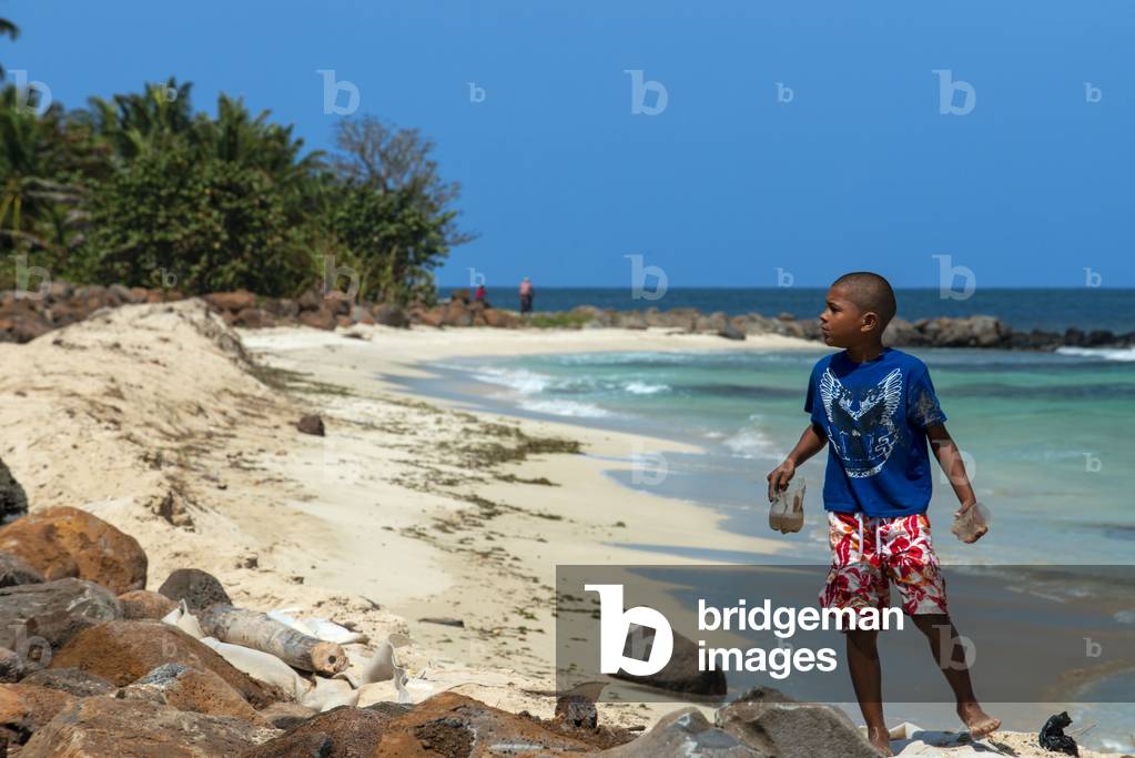Boy playing in the beach, Corn Island, Caribbean Sea, Nicaragua, Central America, America (photo)