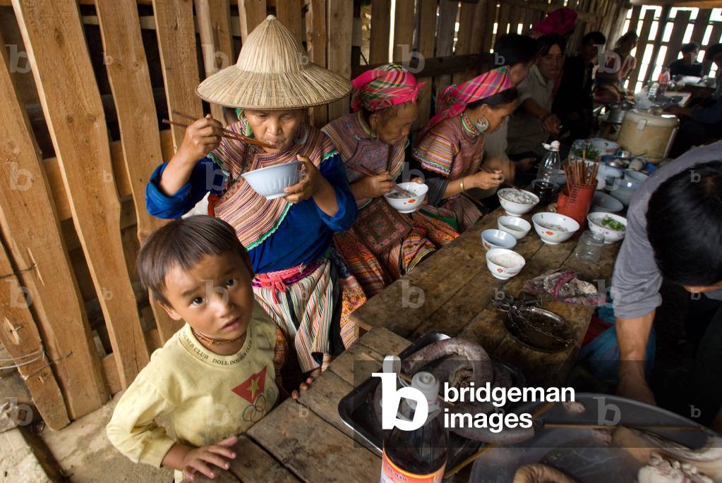 Bac Ha sunday market restaurant, Flower Hmong people in traditional dress at weekly market, Sapa, Vietnam (photo)