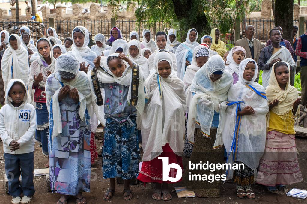 St Mary of Zion church, Aksum, Ethiopia, Several separated boys and girls are doing catechesis inside the church of St Mary of Zion in Axum (photo)
