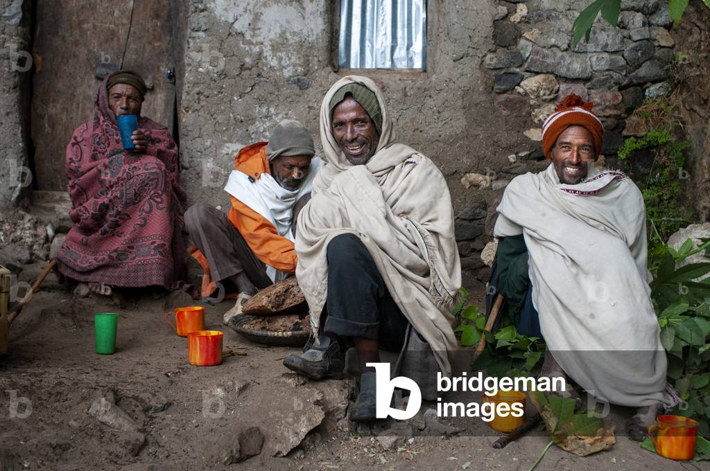 Local people sharing food in nakuto lab cave church, Amhara region, Lalibela, Ethiopia (photo)