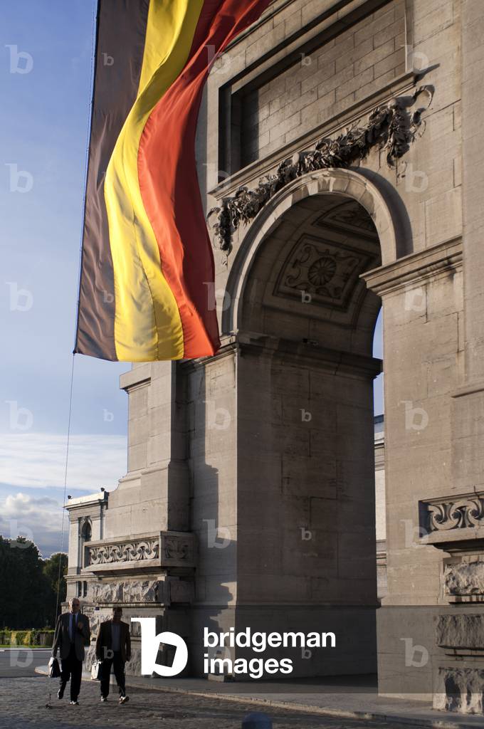 Belgium flag under The Triumphal Arch in Cinquantenaire Parc in Brussels, Belgium (photo)