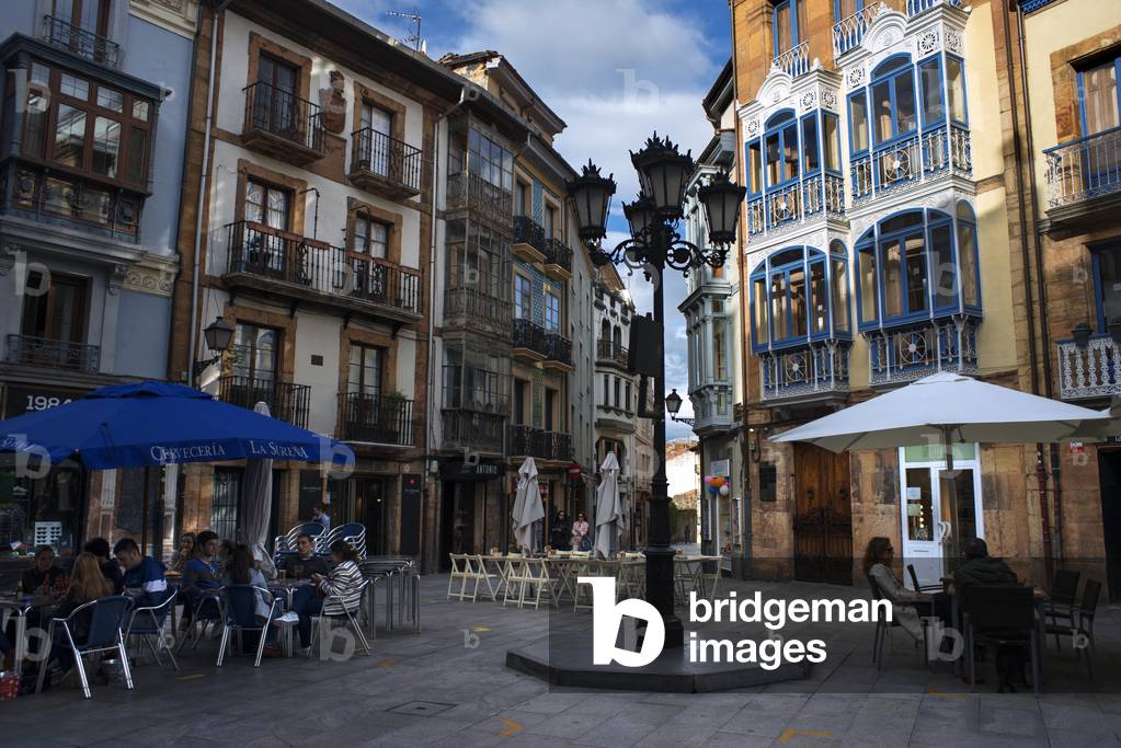 People sitting at a terrace in the Center of Oviedo City, Asturias, Spain (photo)
