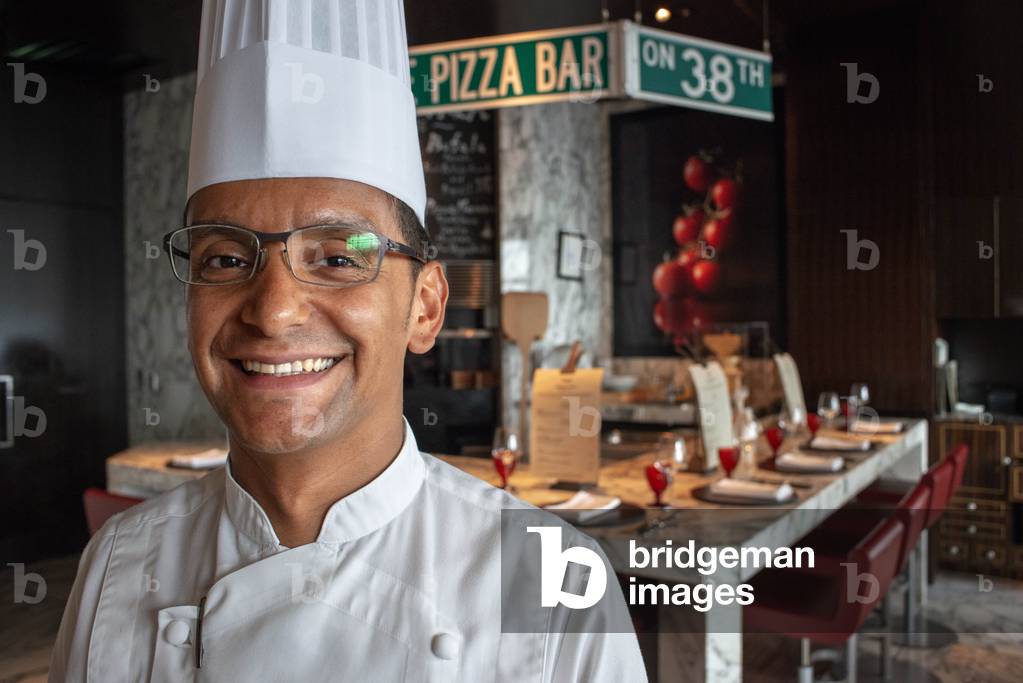Chef of Pizza bar restaurant on 38 th floor of Mandarin Oriental Hotel on Honshu Island, Tokyo, Japan, March 2020 (photo)