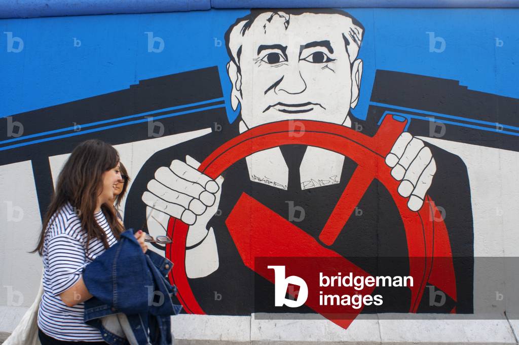 Graffiti on original section of Berlin Wall at the East Side Gallery in Friedrichshain Berlin, Germany (photo)