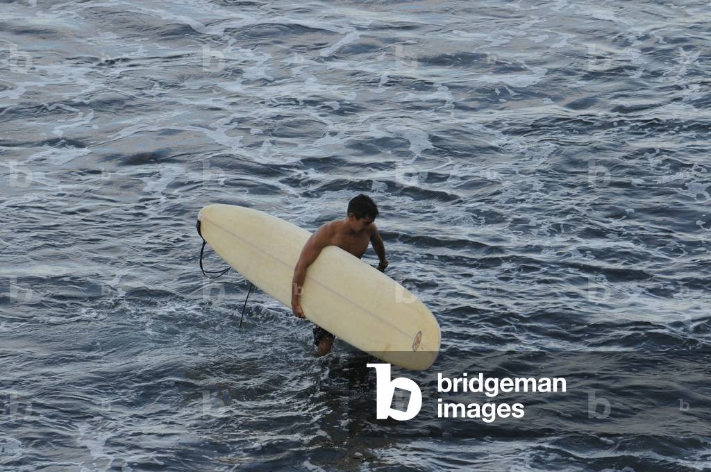 Surfer at Honoli'i Beach, Big Island, Hawaii (photo)