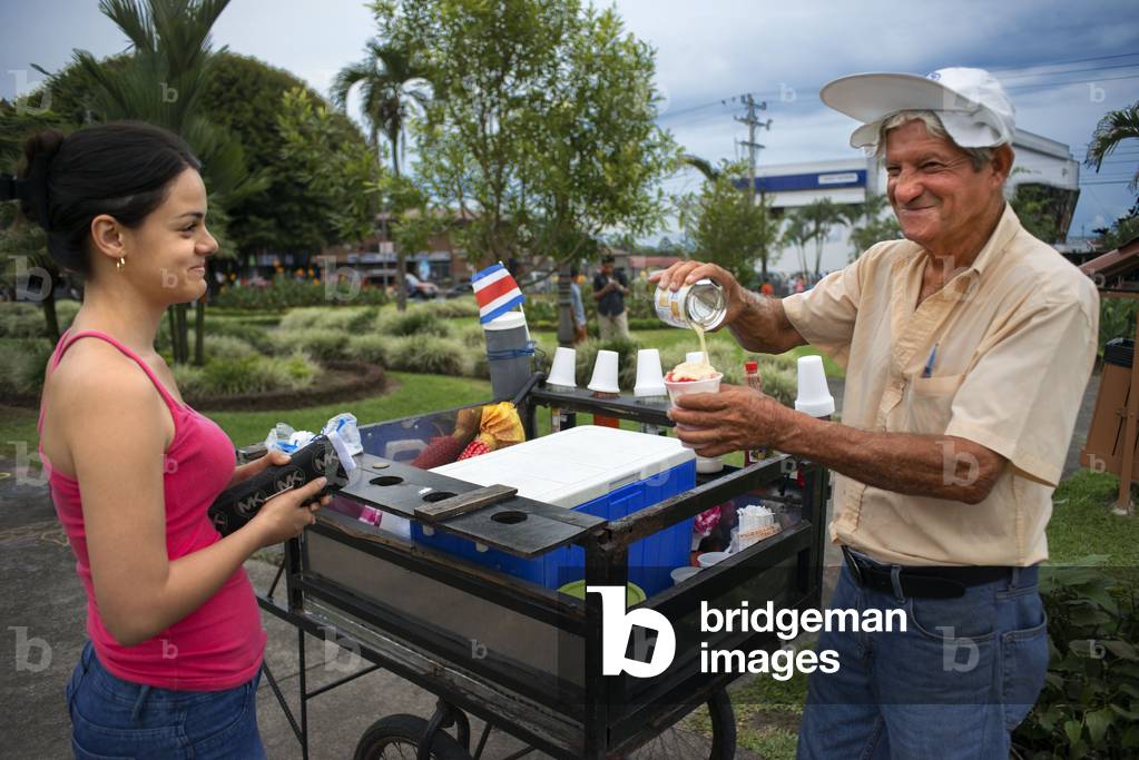 Local ice cream seller in Central Park in La Fortuna village, Alajuela province, Costa Rica, Central America (photo)
