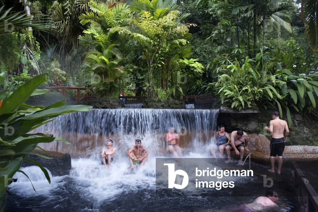 Hot springs from the Arenel Vocano at the Tabacon Grand Spa, Costa Rica, Visitors enjoys one of the warm streams that flows through Tabacon Hot Spring Resort and Spa Costa Rica (photo)