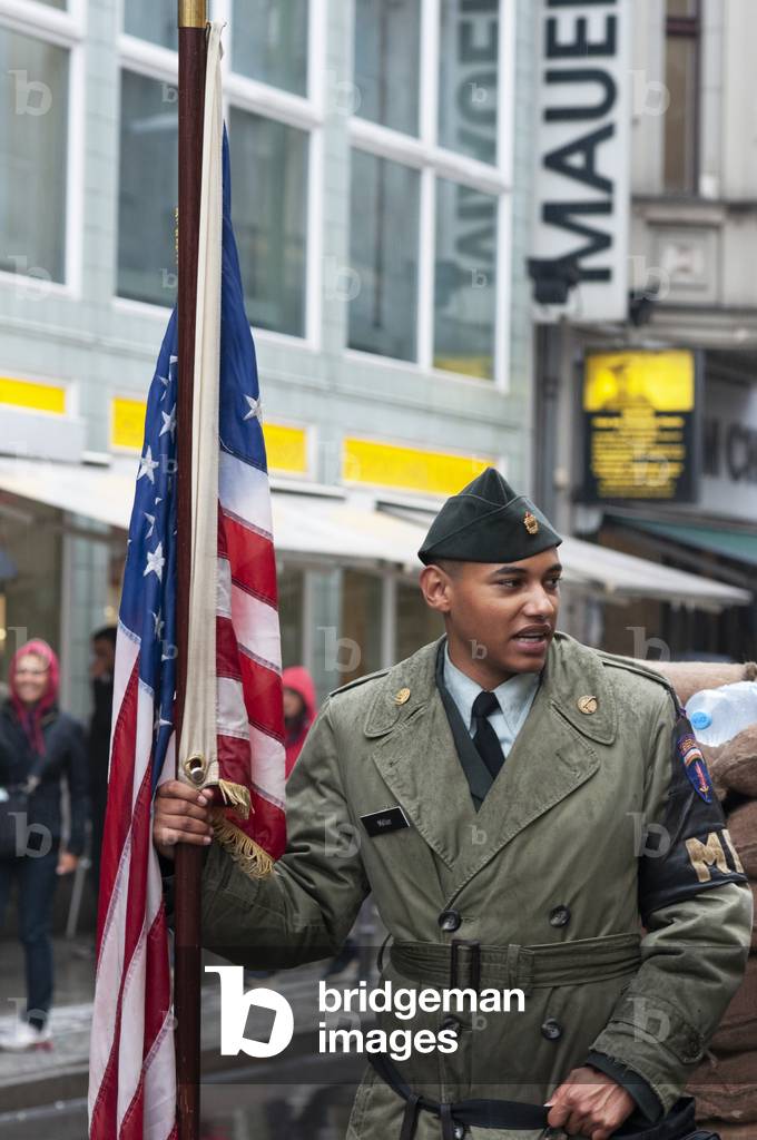 Checkpoint Charlie US Army checkpoint and guardhouse reconstruction at the former crossing point between East and West Berlin in Berlin, Germany (photo)
