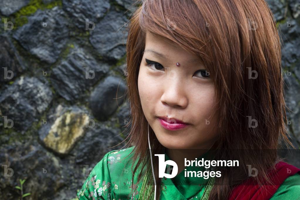 Portrait of a young Nepalese girl near Bandipur Hanging bridge in Nepal, Kathmandu Valley (photo)