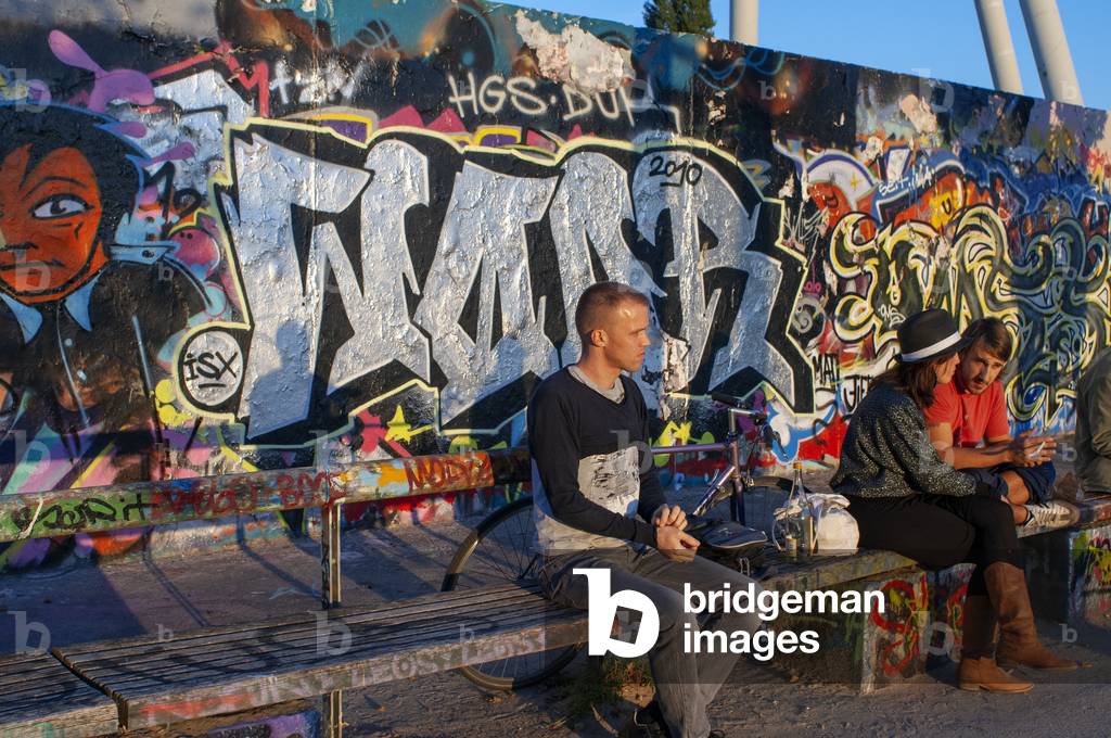 A former part of the Berlin Wall death strip, Graffiti on Mauerpark wall in Berlin, Germany.  (photo)