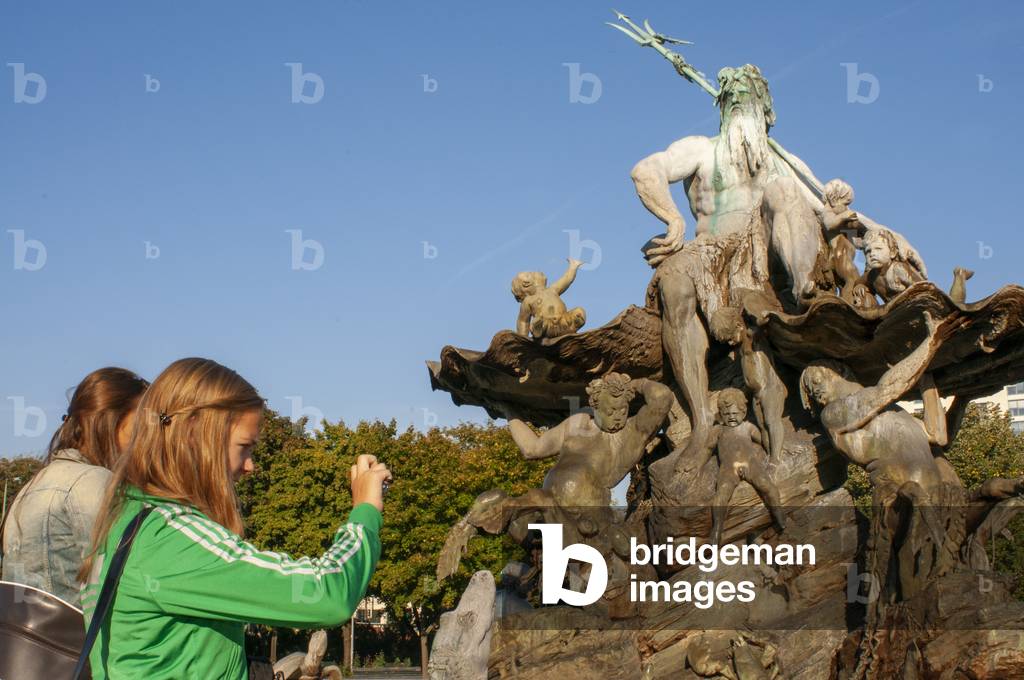 Neptune fountain in front of the St. Mary Church or Marienkirche in Mitte in Berlin, Germany (photo)