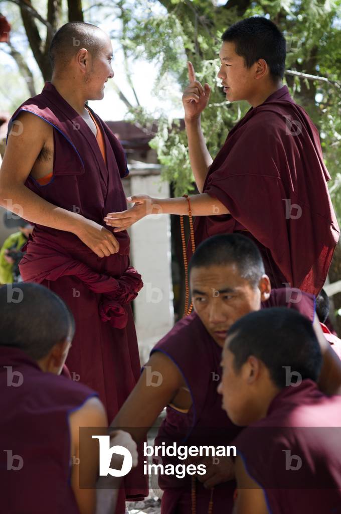 Monks debating in the Debating Courtyard at Sera Monastery, Lhasa, Tibet (photo)