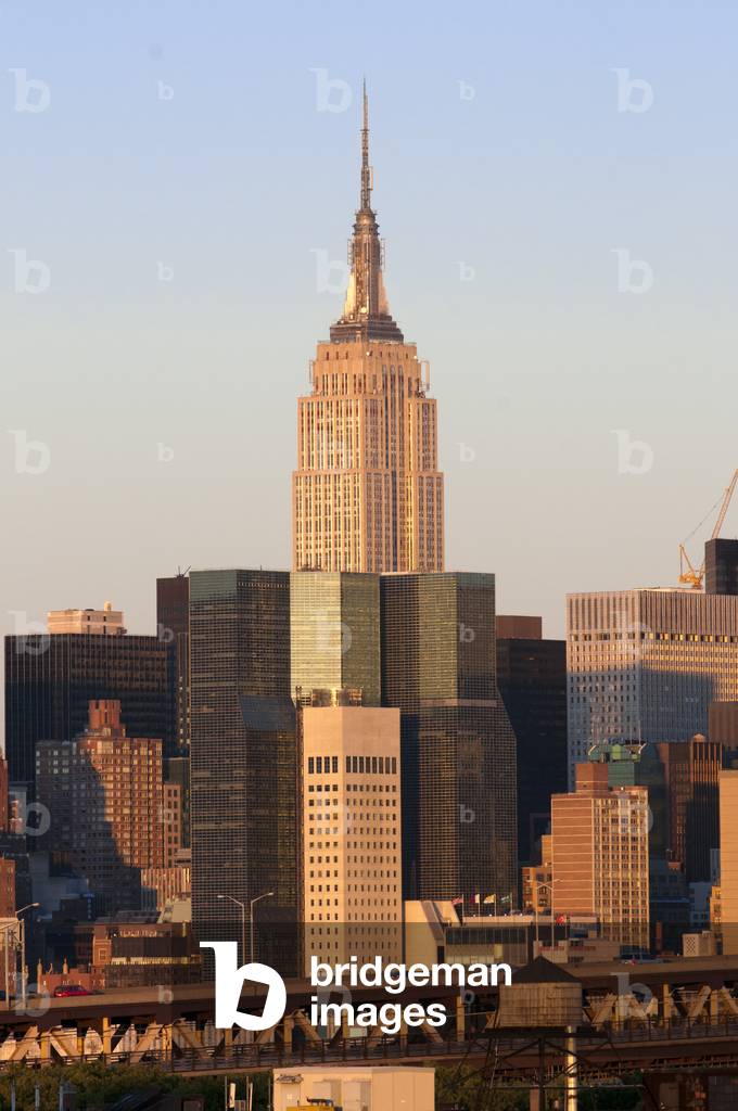 Empire state building and Queensboro Bridge, Manhattan skyline viewed from Queens, New York, USA (photo)